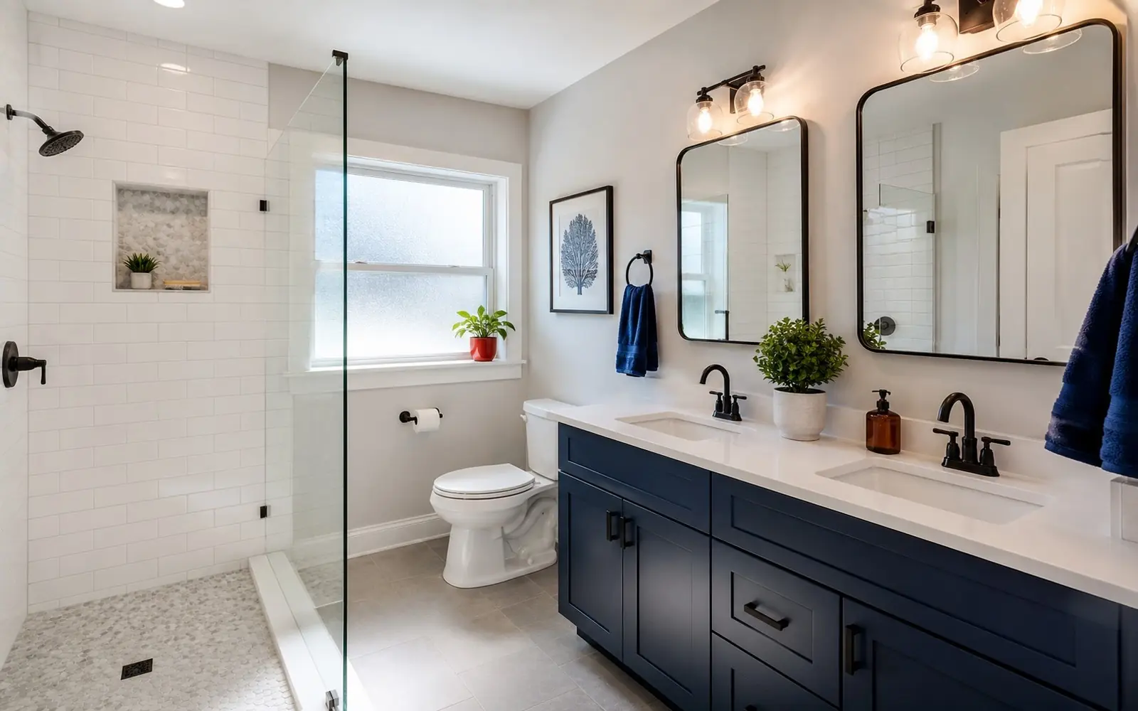 Bright remodeled bathroom with a double vanity and glass walk-in shower